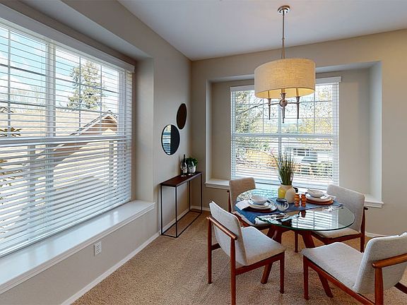 Separate dining area with window seat and plenty of natural light