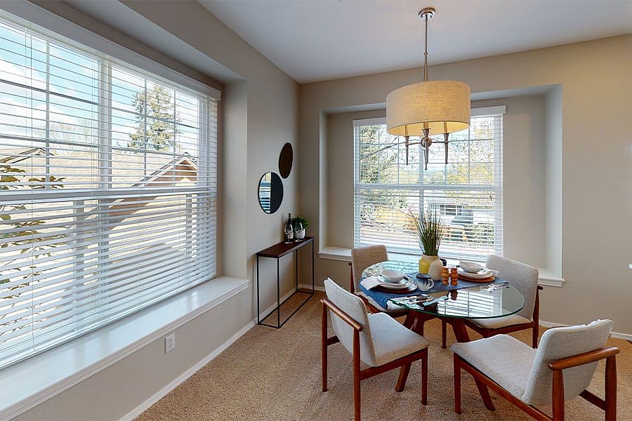 Separate dining area with window seat and plenty of natural light