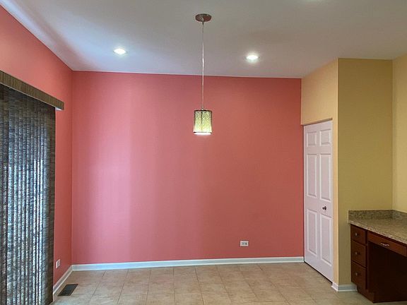 Dinning area next to Kitchen, has pantry and a computer desk