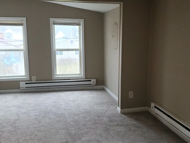 Large living room (multiple windows, natural light)