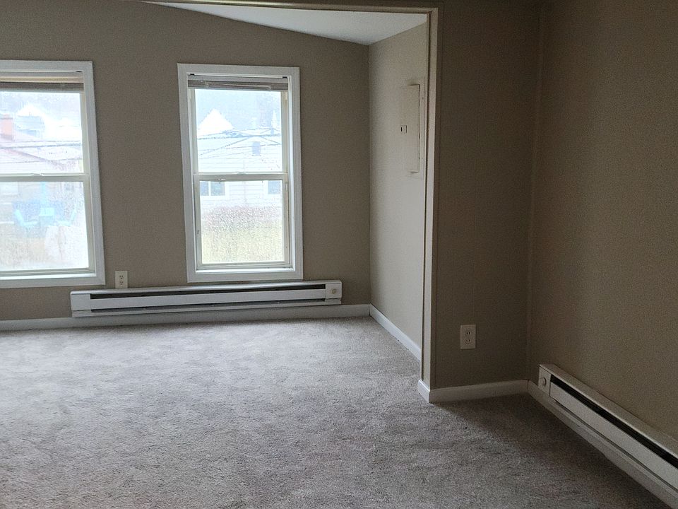 Large living room (multiple windows, natural light)