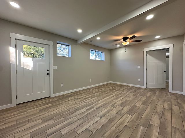 Large Family Room with ceiling fan and recessed lights