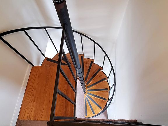 Use the circular stairway or hall stairs to second private entrance to access the fourth floor bedrooms.