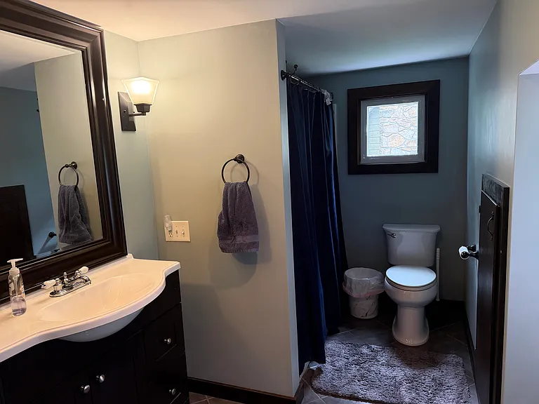 Upstairs bathroom. Has built in storage cabinet, tub with shower, large closet with plenty of storage.