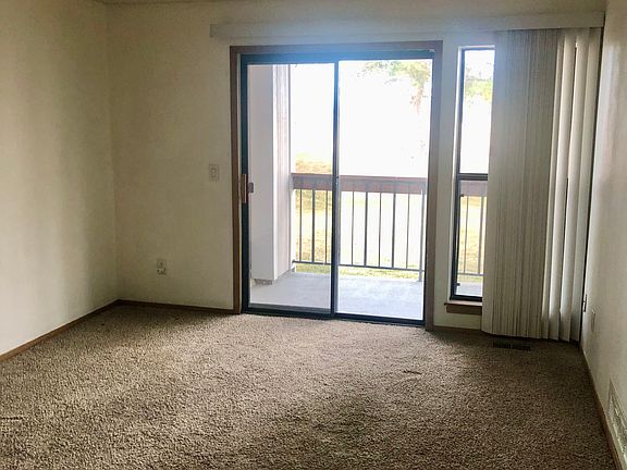 Living room with large slider and deck