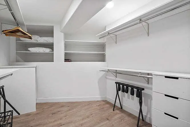 Ample storage space and organization in our spacious walk-in closet.