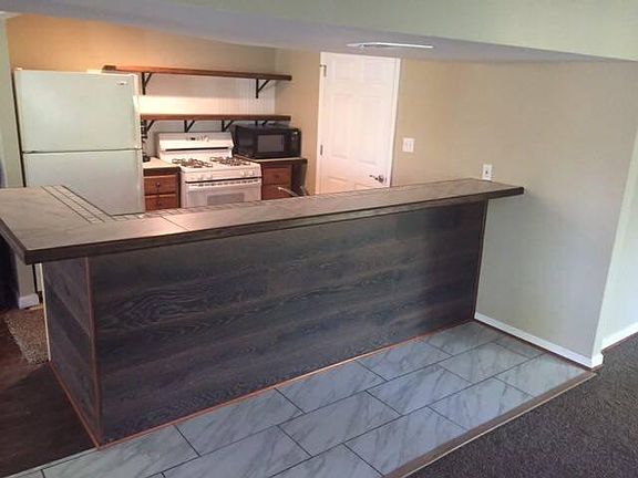 Full Kitchen with plenty counter space & bar stools included ... open Concept with large cabinets