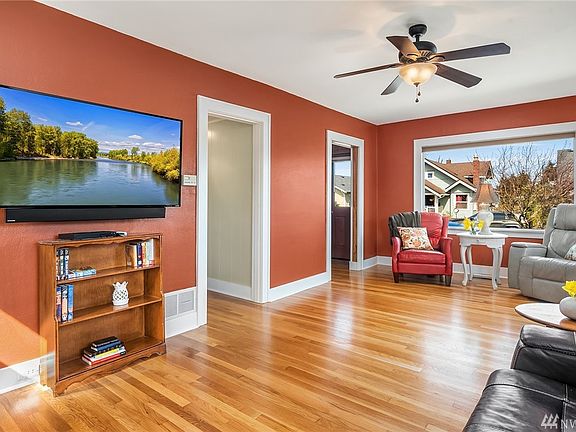 Light and bright living room with wood burning fireplace