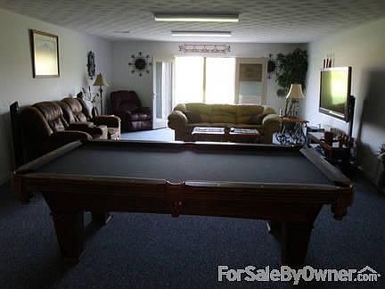 3 car side entry garage with ample extra parking!