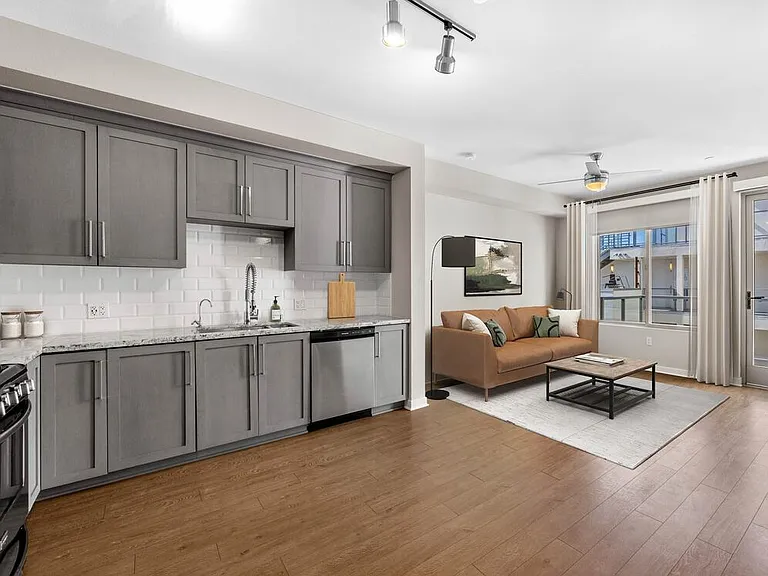 Kitchen, living, and dining area with hard surface flooring