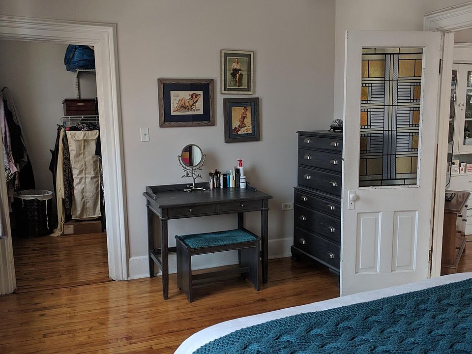 This is bedroom 1 it is in the front of the apartment with access to the smaller bedroom/office/ walk-in closet.