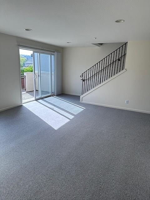 living room with sliding glass door to balcony area