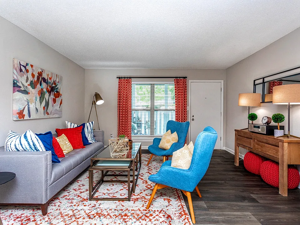 Spacious living room with modern furnishings and natural light.