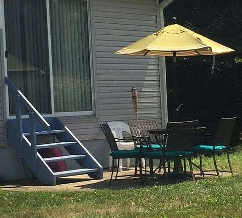 Back Patio with mowed yard for Summer grilling and yard games.