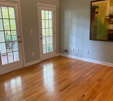 Formal living room or office overlooking a manicured front yard