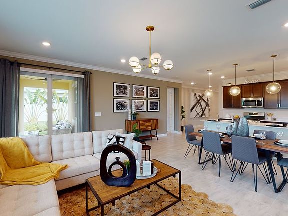 This contemporary gathering spot is ideally located near the dining area and kitchen, as the perfect