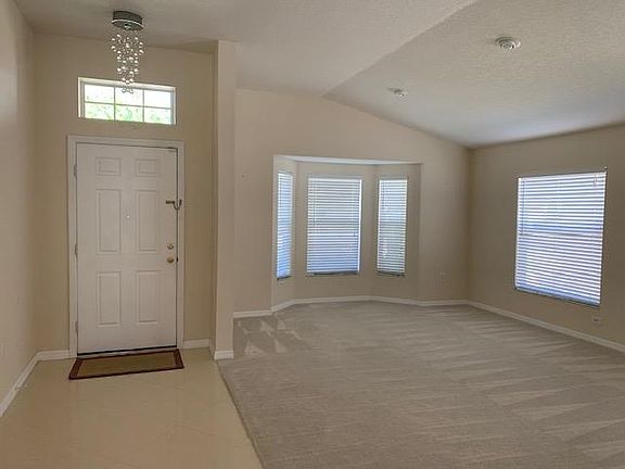 Main entrance, Formal Living and Dining room. Tiled entry Hallway and new plush carpet