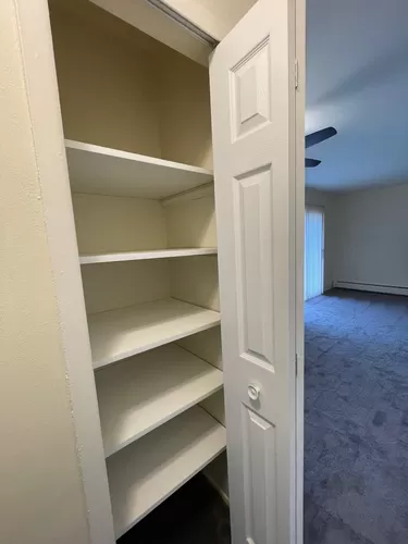 Large linen closet has brand new easy clean shelving and new door. - 8105 Huntington St #8