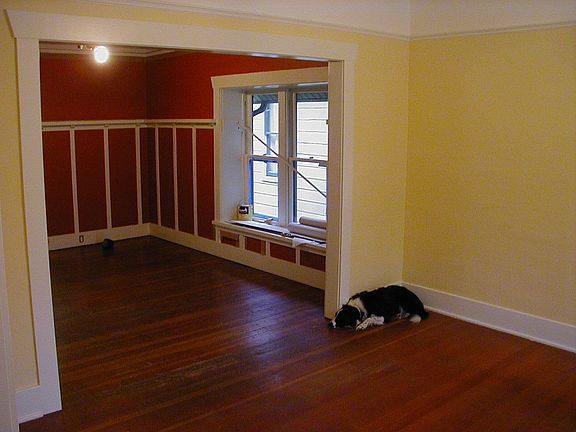 living room into dining room, high ceililngs & box beams in dining