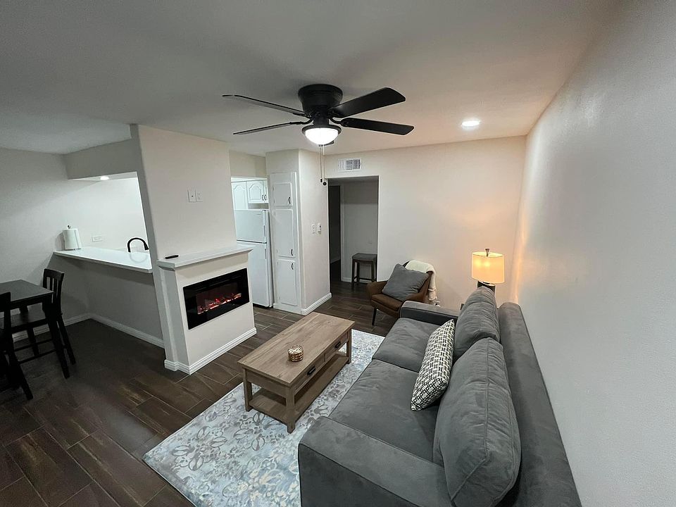 Living/Dining area. New floors. New furniture. Electric fireplace.