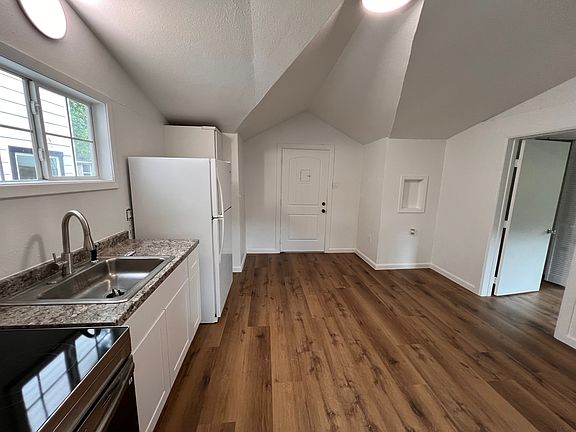 Beautiful fully repainted kitchen with luxury vinyl wood planks.