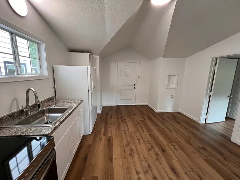 Beautiful fully repainted kitchen with luxury vinyl wood planks.