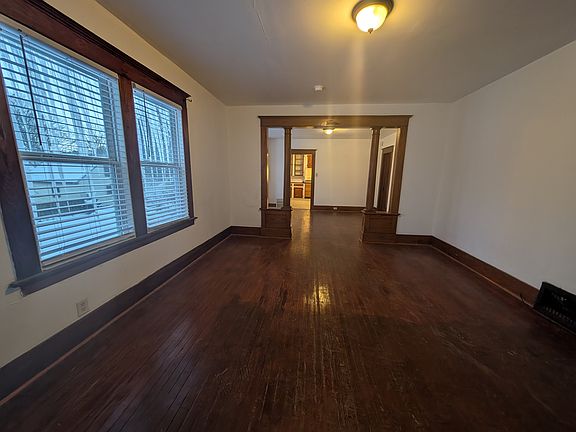 View of living dining rooms from 3 season porch