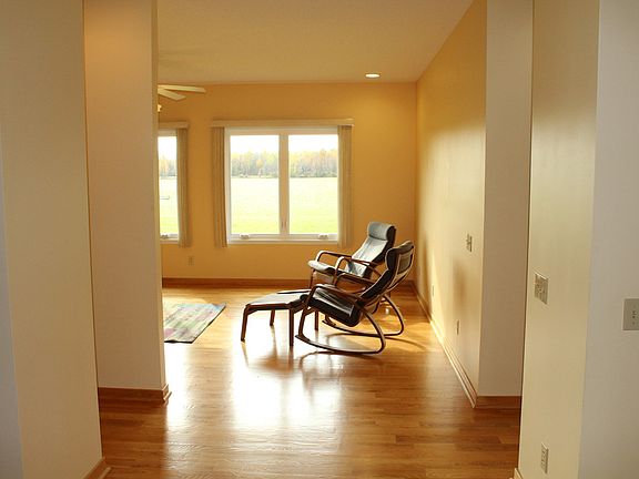 The front door opens to a generous foyer with formal dining to the left and the main living room straight ahead.