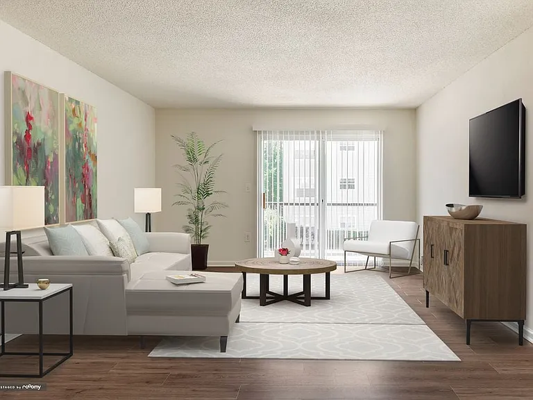 Renovated Package I living area with hard surface plank flooring