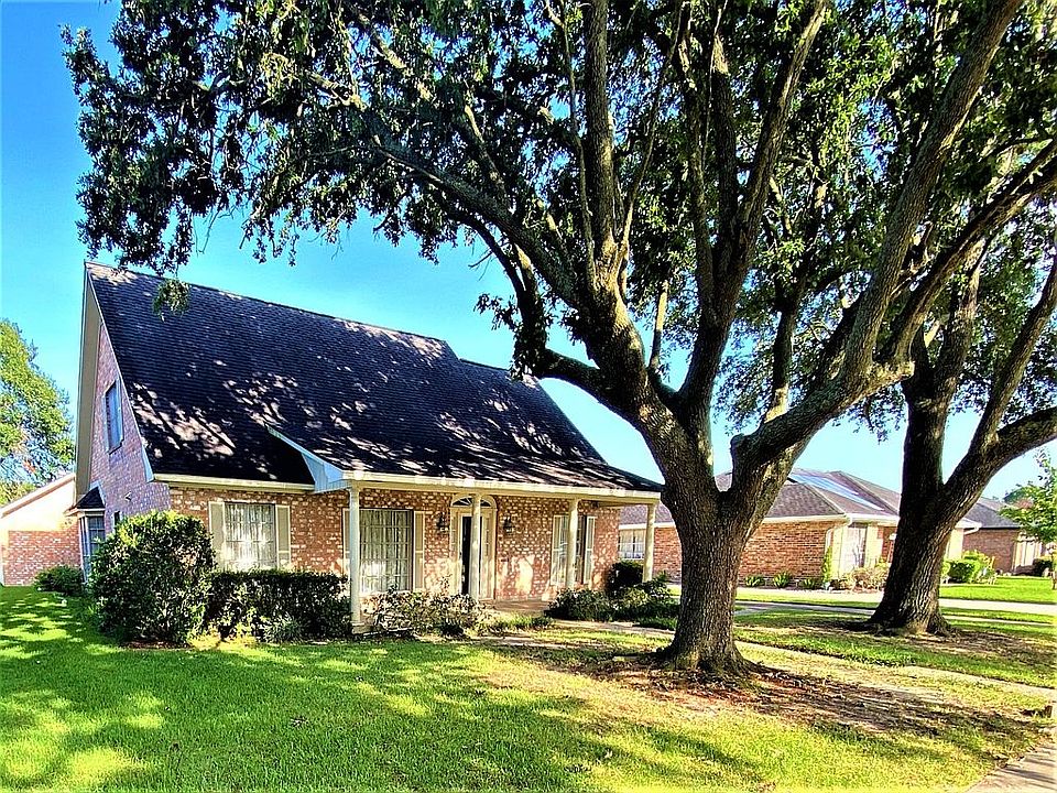 Oaks frame large front porch