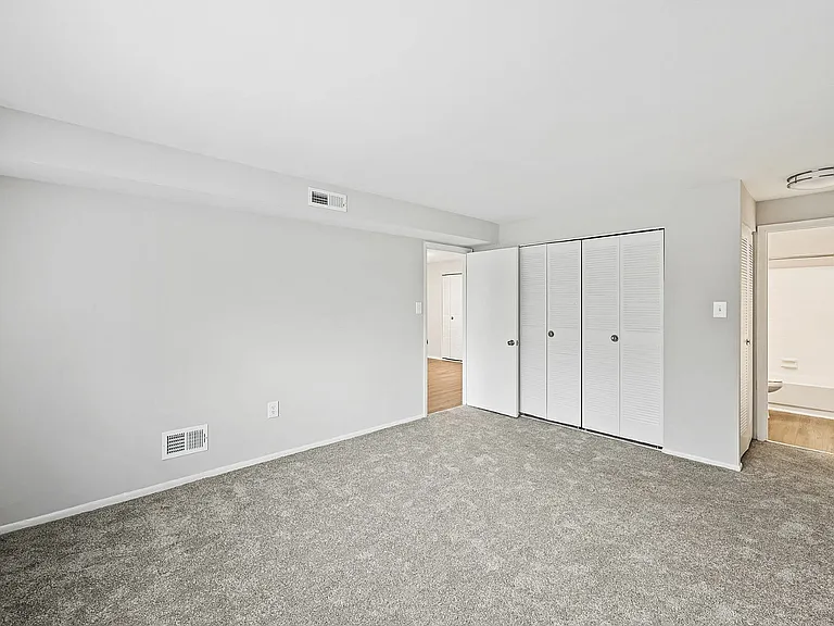 Experience serenity in this bright and spacious bedroom with ample storage.