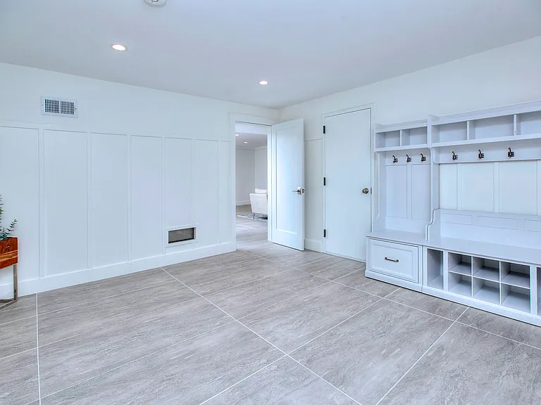 Enter into the spacious mudroom from the garage.