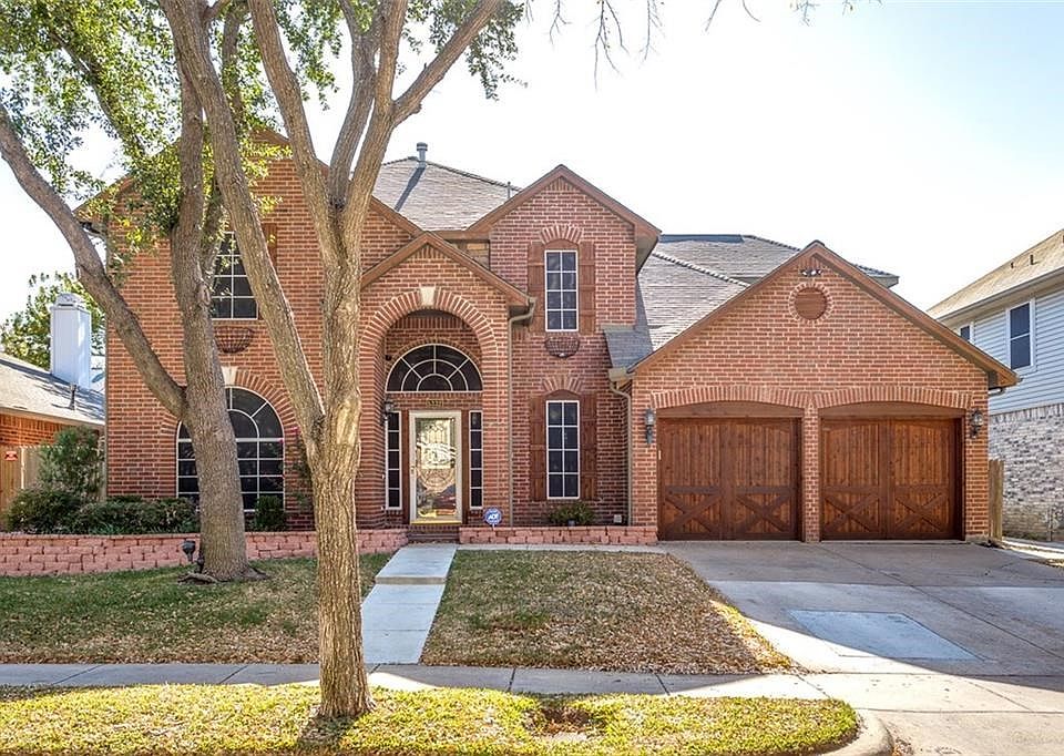 Brick 2 story with cedar shutters and coach garage doors. Loaded with updates and a pool and nestled within a tree lined neighborhood in Keller ISD!