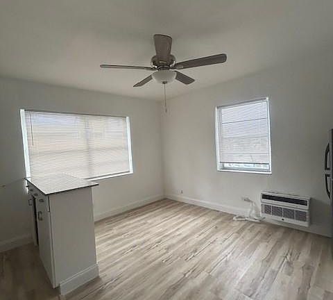 incredible great room with lots of light and plank wood flooring - remodeled kitchen and terrific A/C's