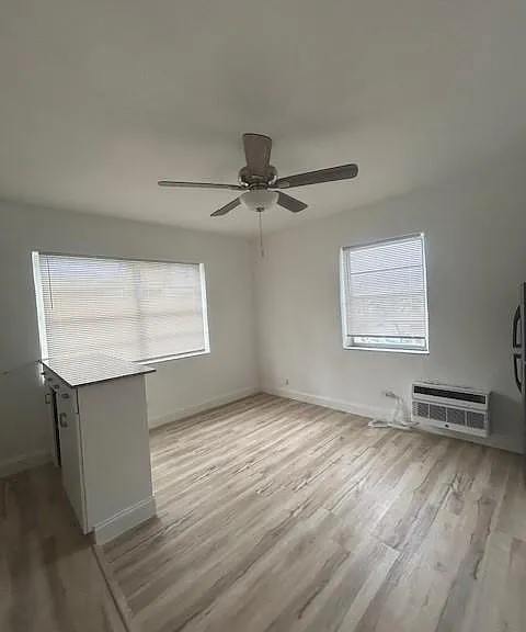 incredible great room with lots of light and plank wood flooring - remodeled kitchen and terrific A/C's
