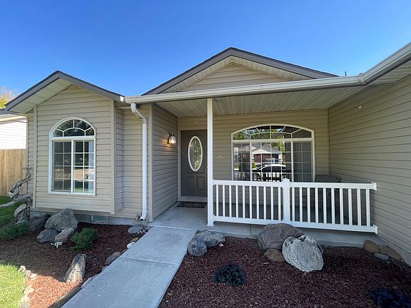 Beautiful, easy, care-free landscaping by the front door with a nice patio to enjoy evenings and meet neighbors.