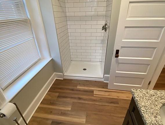 Light bathroom with granite and tile