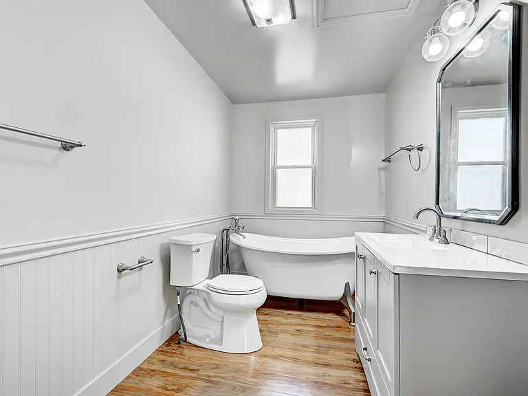 Dreaming of a claw foot tub? You've found it in this home! The upstairs bath features waterproof wood-look flooring, and a DEEP clawfoot tub and all new fixtures!