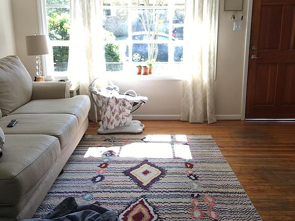 Living space with oversized bay window.
