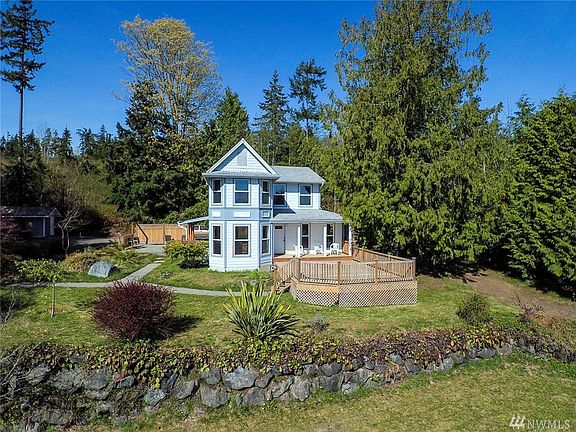 Outbuilding on left is the pump house with a shop space attached behind it.