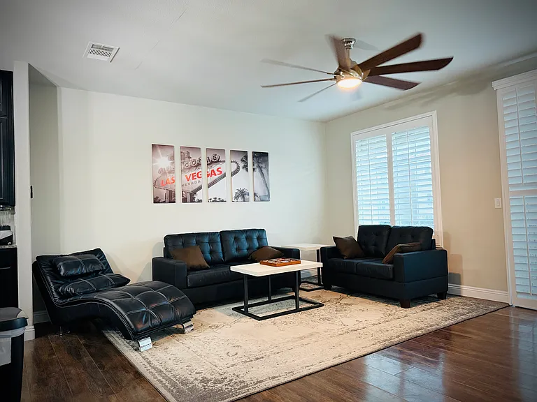 The living room seats 5+ comfortably with a 65in SmartTV to enjoy. Plus balcony access & shutters.
