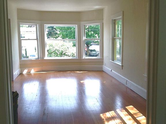Lots of sun!! Wood Floors, high ceilings & bay windows!
