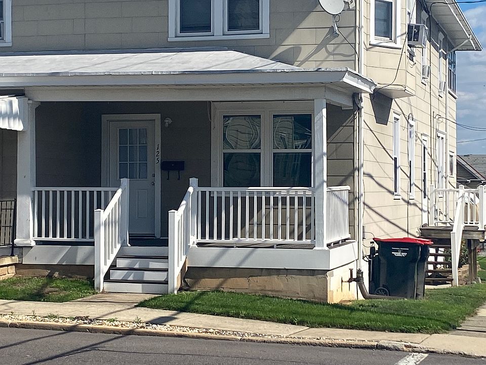Front porch. Front entrance into living room and side entrance into kitchen.