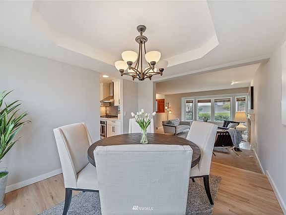 The adjoining formal dining room is accented with a tray ceiling and adjoins the formal living room for easy entertaining.