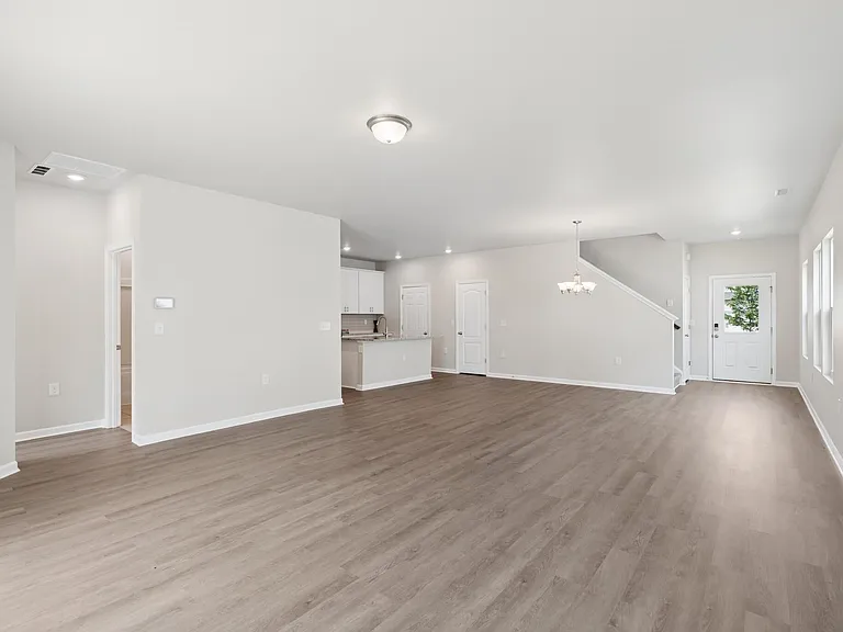 Family room with brand new luxury vinyl hardwood look flooring