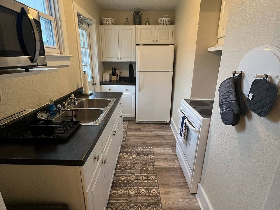 Full kitchen with appliances and essentials