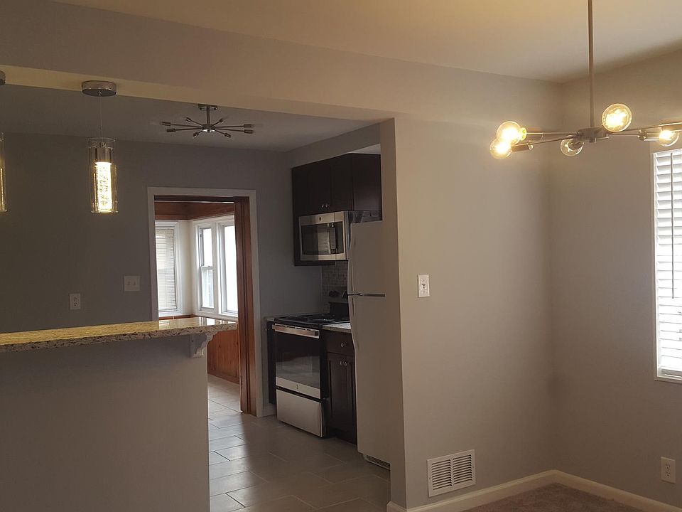View of dining area, kitchen, sun room from living room