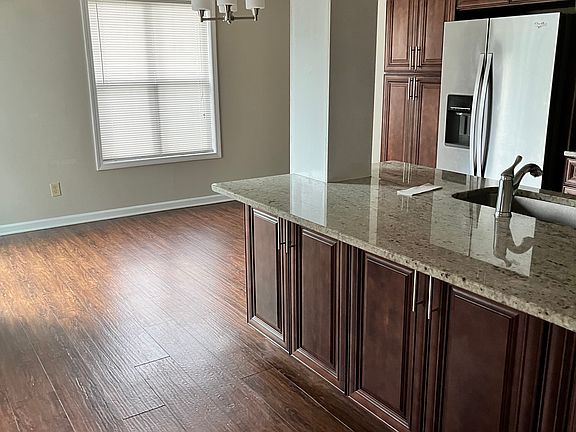 Very Bright and spacious Dining Room/Home office which overlooks the deck. Notice the usable cabinets for storage in the Breakfast Bar Seats 3 ppl