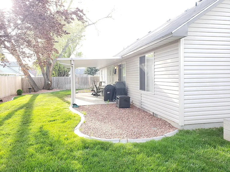 Backyard
Red rock area is now larger patio with concrete