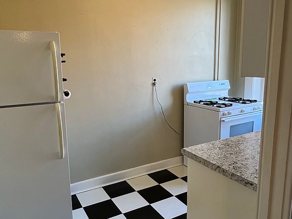 Kitchen with room for prep table or cafe table and chairs.